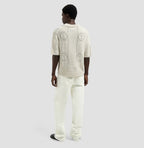OLAF Logo Knit Polo Off-White heren gebreide polo met face logo en relaxed fit